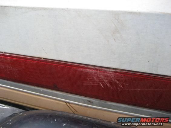 1981 Ford Bronco rear quarter panel with red taillight and chrome trim