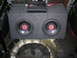 1994 Ford Probe - Car audio amplifier and dual subwoofer box installed in a vehicle's trunk area.