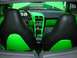 1994 Ford Probe - The interior of a car features custom bright green upholstery and trim, contrasting with black seats and dashboard elements.