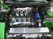 1994 Ford Probe - Engine bay view of a Ford V6 engine, a custom intake system and an aftermarket cover with "SPKD CAUTION SHARP BLADES" text.