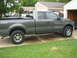 2004 Ford F-150 - Side view of a gray 2004 Ford F-150 pickup truck with aftermarket wheels.