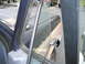 1981 Ford Bronco - The interior of a truck is visible through the open driver's door, with another vehicle in the background.