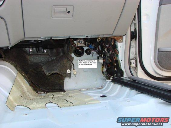 This is the area that was getting wet.  That sound insulation doesn't come out without removing the dashboard.  It goes all the way up to the base of the windshield.  BTW - Nice job at the factory placing that tarmac sound deadening.  It is rotated 90Â° Clockwise and about 6 inches inboard from where it should be!