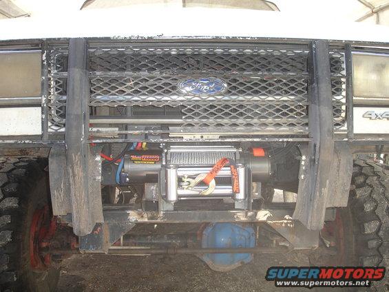 Front of Ford truck with a winch mounted behind the grille guard. Has a Ford logo on the grille and '4x4' badge visible