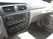 2001 Ford Taurus - The interior of a 2001 Ford Taurus is visible, focusing on the dashboard and center console.