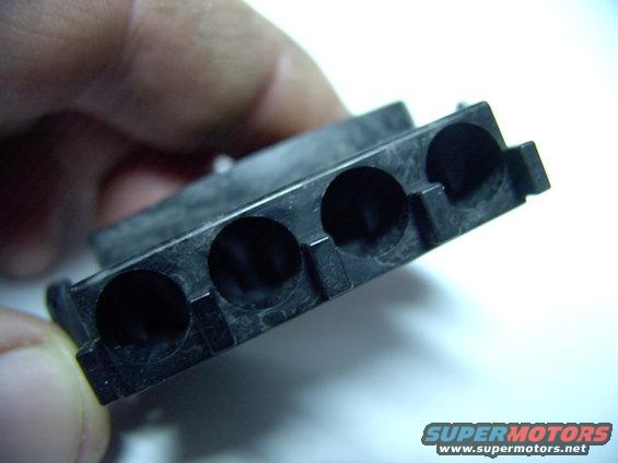 The rubber barbs, on the stock wires, seal into each of these holes on the new connector