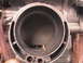 2007 Yamaha YZ450F - A close-up view inside a motorcycle carburetor, revealing its internal structure and components.