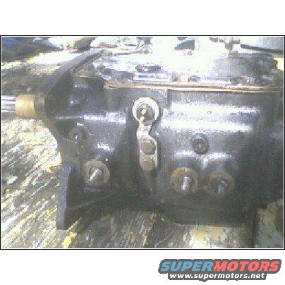 Black transmission housing with visible bolts and linkage