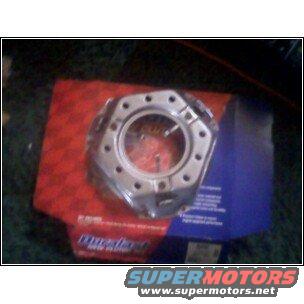 Transmission part on top of a red and blue box. Text on box says Dynatech