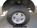 2000 Ford F-250 - The rear wheel and suspension of a truck are shown, with visible text overlaying the image.