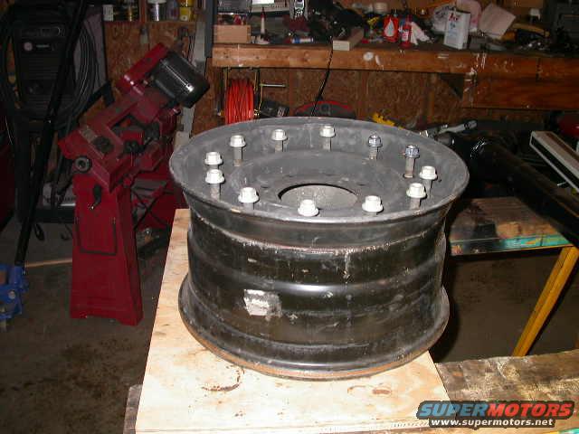 My unmolested H1 wheels, of the 12 bolt variety.  I got a steal on 5 of them, 4 of which were brand new and had never had a wheel mounted on them before.  