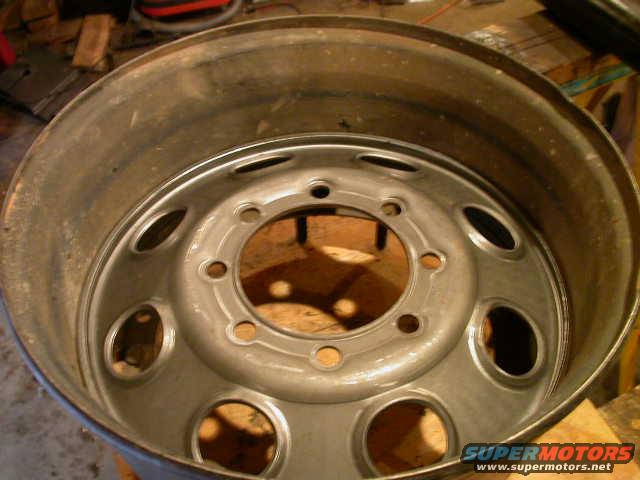 New wheel center dropped all the way into wheel and resting on the wheels lower lip.