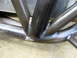 1995 Ford Bronco - The photo shows a close-up of welded metal tubing, possibly part of a custom vehicle frame or roll cage.
