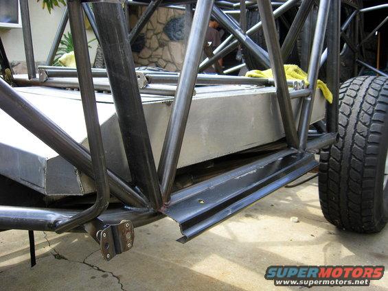 Off-road buggy chassis with fuel tank and tire visible