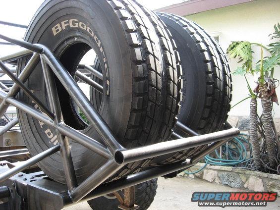 Spare tires mounted on a metal roll cage structure. Tires are BFGoodrich brand
