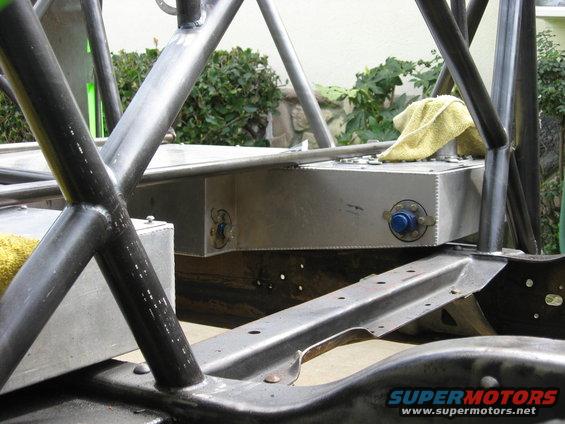 custom fuel tank and roll cage structure, yellow towel on top of tank