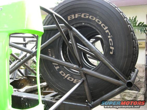Spare tire with BFGoodrich Baja T/A text on roll cage