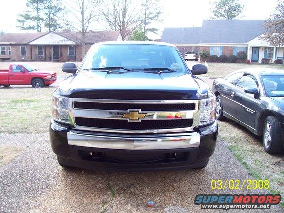 Front view of black 2008 Chevrolet Silverado 1500 with chrome grille and badge