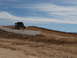1996 Ford Bronco - Off-road buggy airborne during a jump on a dirt track.