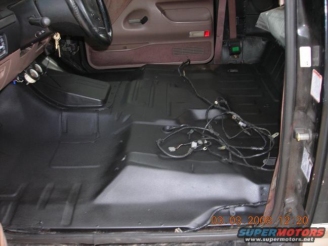 1993 Ford Bronco interior with exposed wiring and clean floor pan