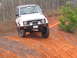 1987 Suzuki Samurai - This 1987 Suzuki Samurai navigates a challenging off-road course with a driver behind the wheel.