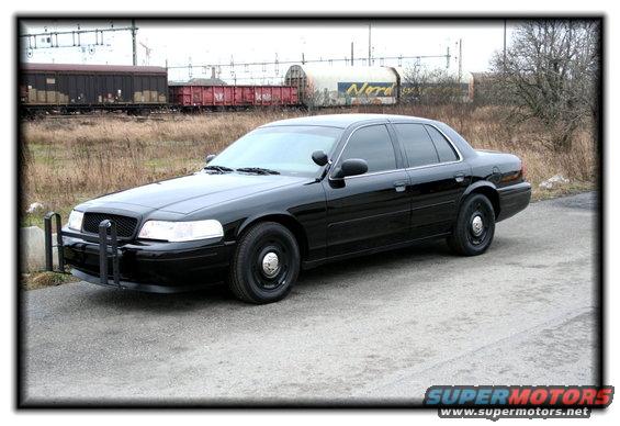 Black 1998 Ford Crown Victoria with push bar, 3/4 front view