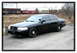 1998 Ford Crown Victoria - This 1998 Ford Crown Victoria features a prominent push bar on its front end, seen from a 3/4 front perspective.