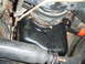 1996 Ford Bronco - Close-up view of engine oil pan and suspension components, with a watermark for Supermotors.net visible.