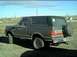 1989 Ford Bronco - This 1989 Ford Bronco is seen from the rear quarter angle, its spare tire mounted on the back.