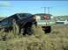 1989 Ford Bronco - This Ford Bronco is parked on a grassy incline, with a red bow adorning its front grille.