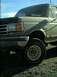1989 Ford Bronco - This truck has a '4x4' badge on the fender and a grille consistent with the 1987-1991 Ford F-Series.