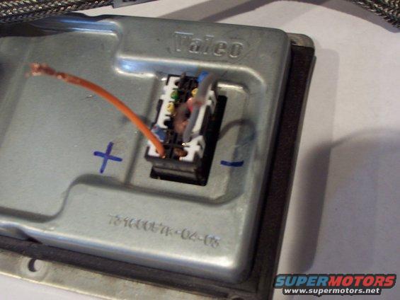 Metal automotive ballast with orange wire and electrical connector