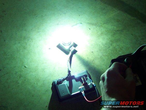 Automotive lighting component with wiring connected to a battery terminal
