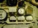 1976 Ford Ranchero - Close-up of a vehicle's dashboard gauges and clock assembly.