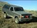 1989 Ford Bronco - This 1989 Ford Bronco is parked on a dirt hill, a red bow on its grille.