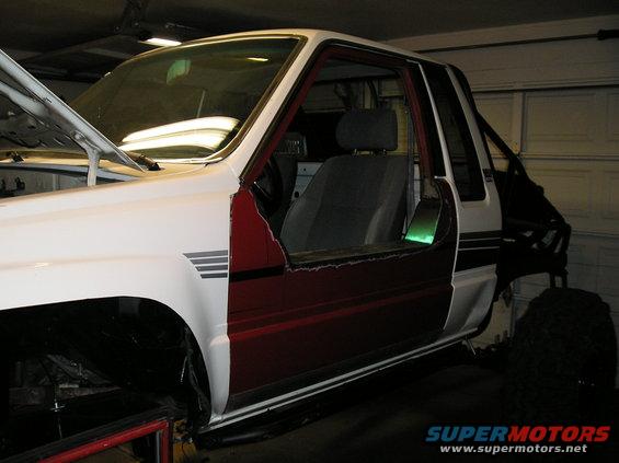 1986 Toyota Hilux pickup truck, doors removed, in garage