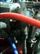 1989 Ford Bronco - Close-up of engine components, including a distributor cap and hoses.