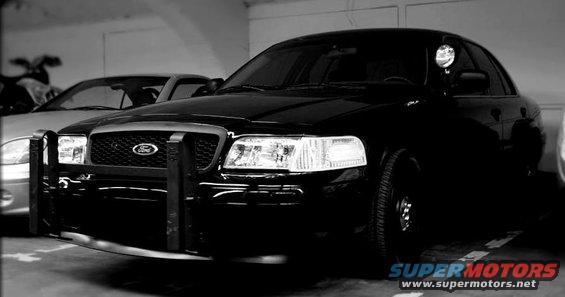 1998 Ford Crown Victoria front view with push bar and another car behind it