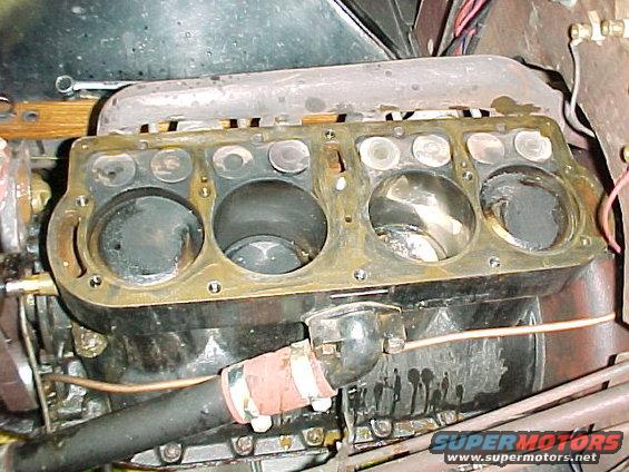 The tape is removed. The block and head were cleaned with lacquer thinner. A sealing adhesive KW Copper Coat was applied with a brush before the head gasket was installed.