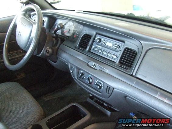 2003 Ford Crown Victoria interior showing dashboard, steering wheel, and center console