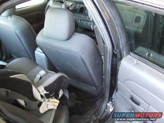 2003 Ford Crown Victoria interior showing front seats and a child seat in the back
