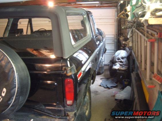 Black 1979 Ford Bronco rear quarter view in garage