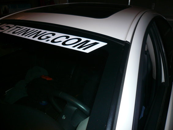 White car windshield banner reads "US TUNING.COM"
