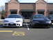 2007 Mazda 3 - Two Mitsubishi Eclipse models are parked side-by-side in a parking lot, with the front of both vehicles visible.