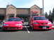 2007 Mazda 3 - A 2007 Mazda 3 and a Mitsubishi Eclipse are parked in front of the Capello Salon and Spa.
