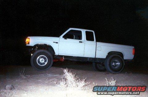 1993 Ford Ranger pickup truck parked off-road at night