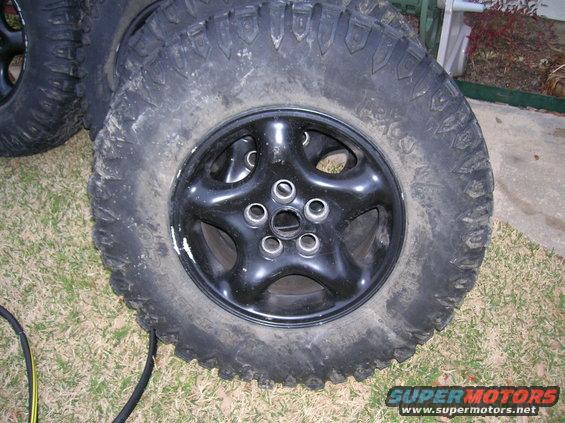 Black alloy wheel with off-road tire