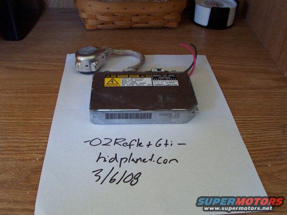 HID ballast and igniter with handwritten "-O2Refle+6ti- hidplanet.com 3/6/09" on paper
