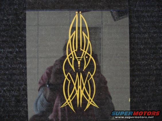 Yellow pinstripe graphic on dark surface