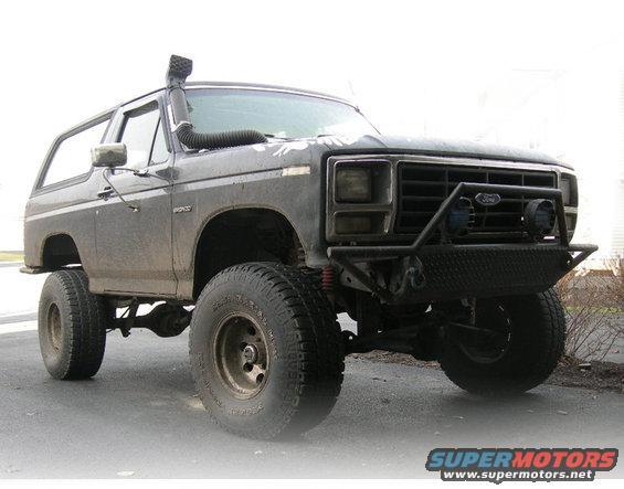 Ford Bronco with snorkel and custom bumper, lifted on large tires